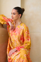 Handcrafted silk Jalabiya with scalloped neckline and flared sleeves
fluid silhouette in golden hour tones
